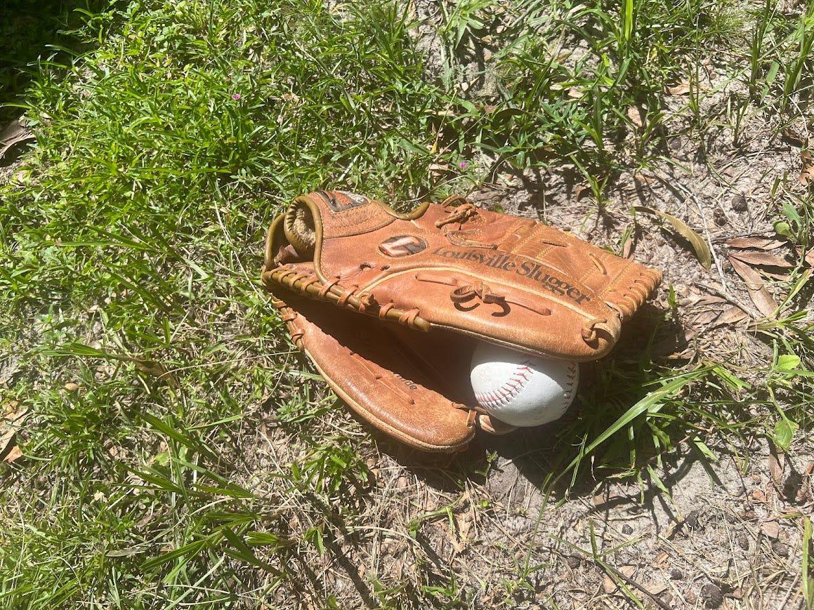 I found my old baseball glove. It was filled with orange dirt and memories.